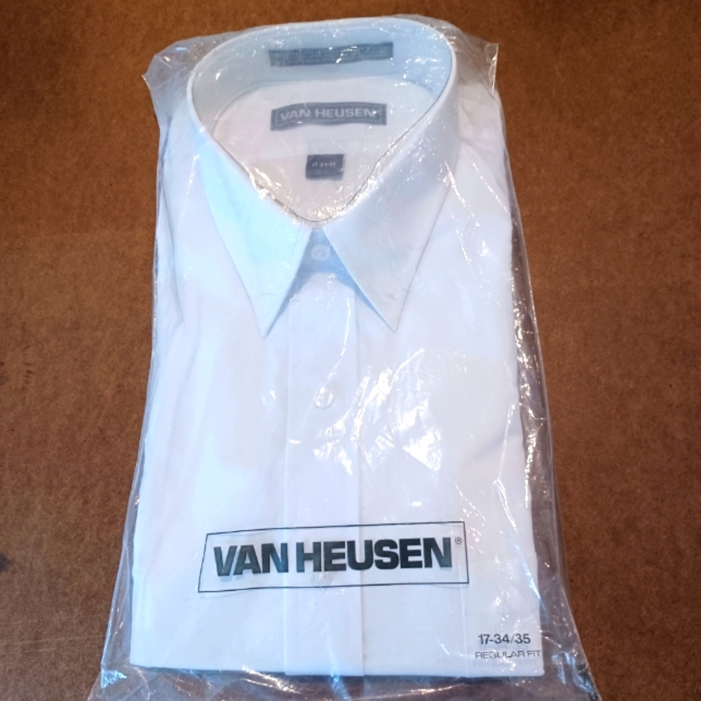 Van Heusen white, long sleeve (button cuff) dress shirt.  17 neck. 34/35 sleeve